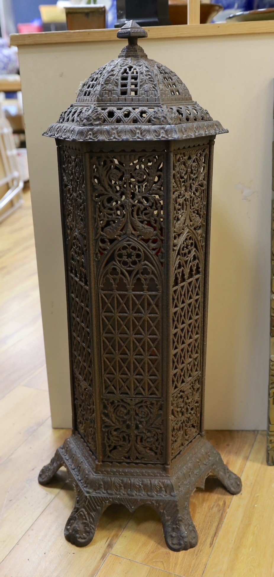 A Victorian cast iron conservatory heater and a printing block display